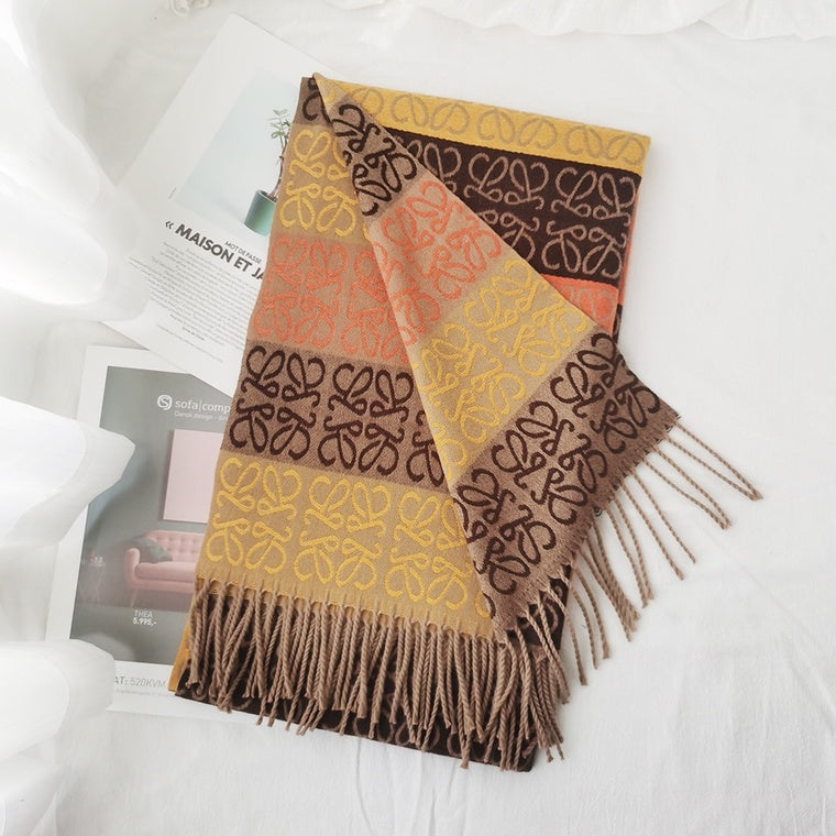 Patterned scarf with fringes on a white surface