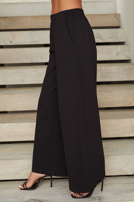 The Viscose Structured Soft Pants in Black. Available at Kadou Boutique. 