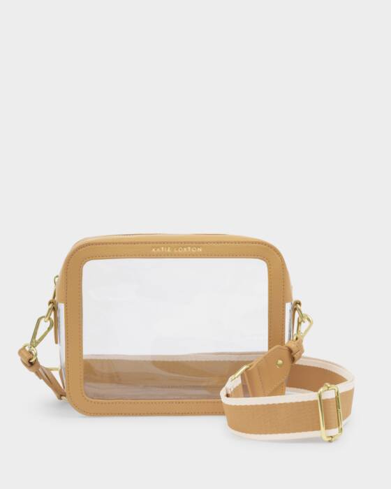 Clear handbag with ochre colored border and strap on a light gray background
