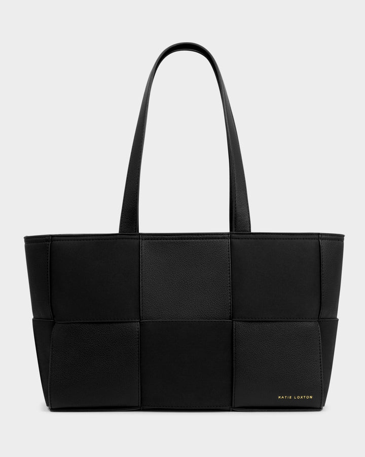 Black quilted handbag on a light gray background