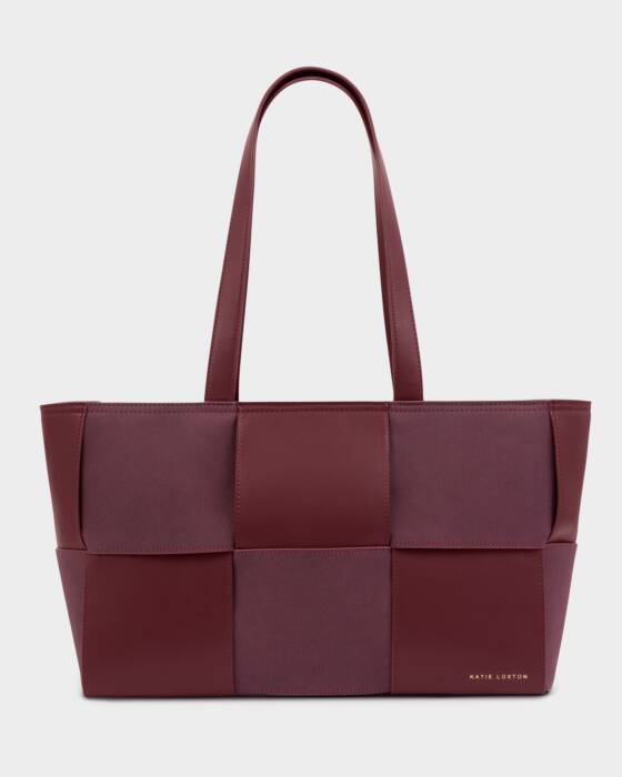 Maroon woven handbag on a light gray background