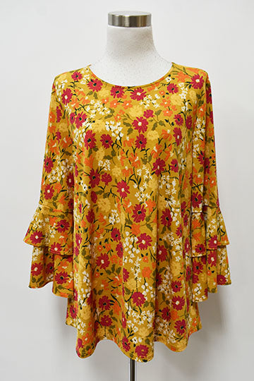 The Tiered Ruffle Long Sleeve Marigold Floral Top from Kadou Boutique.