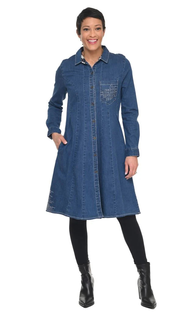 Woman wearing a blue denim dress on a white background