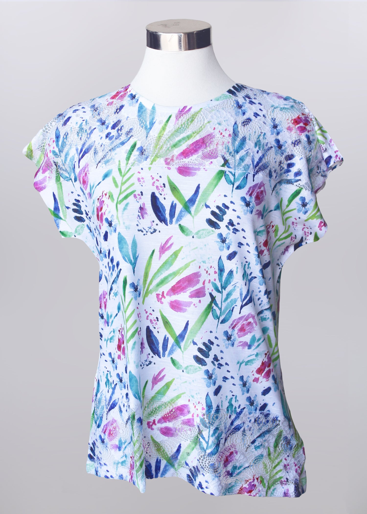 Showing the Short Sleeve Floral Print Top on a half mannequin.