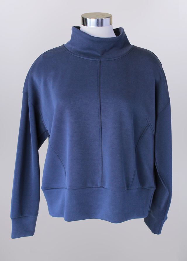 Blue sweatshirt on a mannequin against a gray background