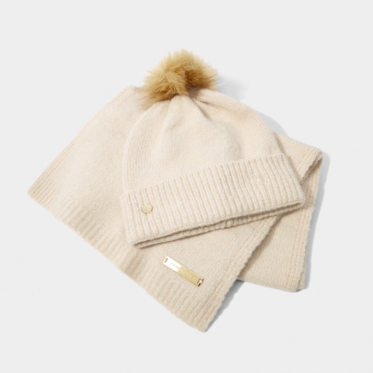 Knitted Hat and Scarf Set in Eggshell color. Available at Kadou.shop or in Store at 1900 Preston Rd 205, Plano, TX.