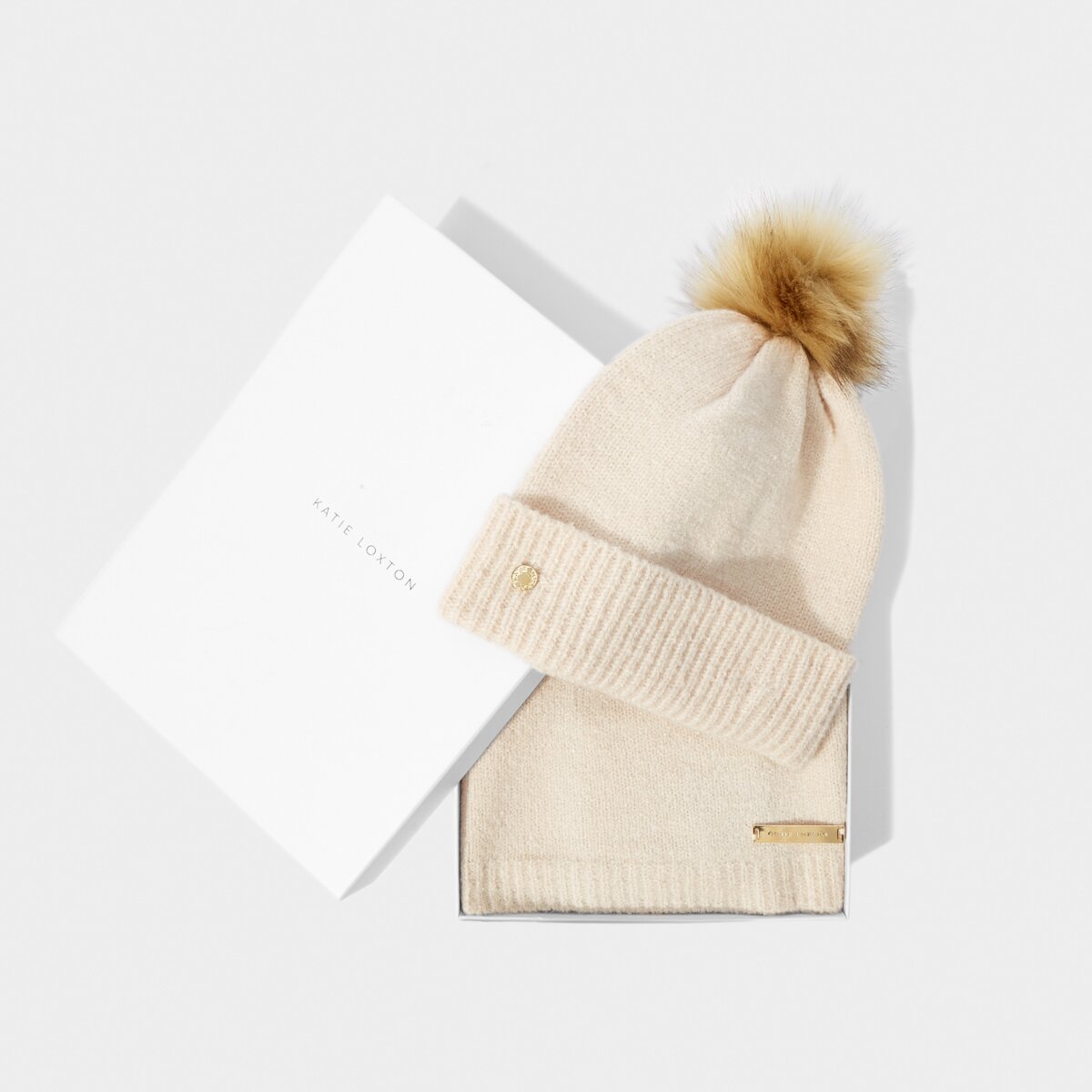 Showing the Knitted Hat and Scarf Set in Eggshell color with the white box that come in it, great for gifting.