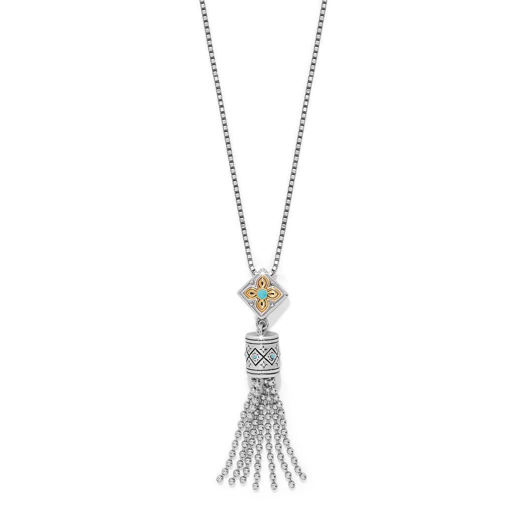 Necklace with a tassel pendant on a white background