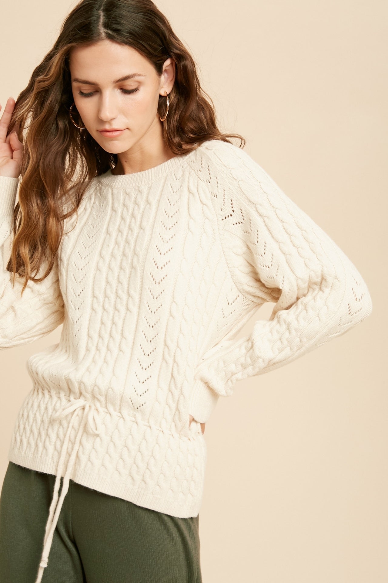 Cable Knit Drawstring Long Sleeve Sweater in Cream color.