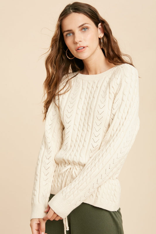 Cable Knit Drawstring Long Sleeve Sweater in cream color.
