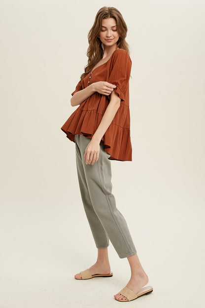 Babydoll Woven Top in Brick color.