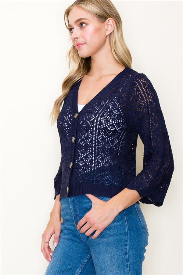 The Crochet Summer Cardigan in navy blue, a side view.