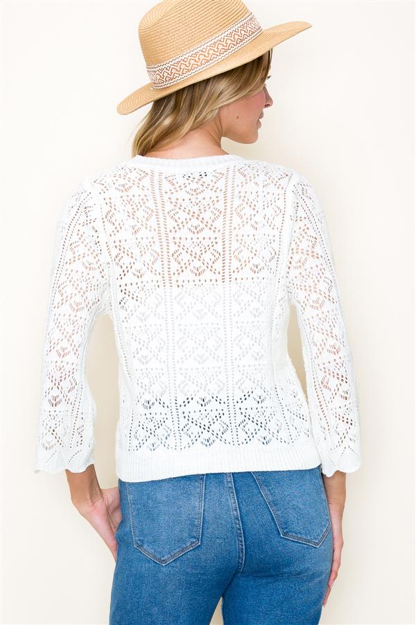 The Crochet Summer Cardigan in off-white color. From the back.