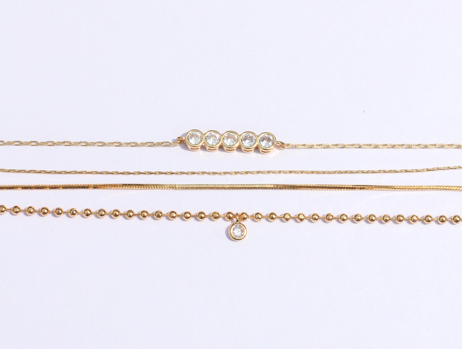 Bracelet Set Cubic Zirconia.  Have fun with this dainty 3-chain bracelet set to complete your look.  You could wear one, two or all of them together and you could layer them with your watch or any piece of jewelry of your choice.