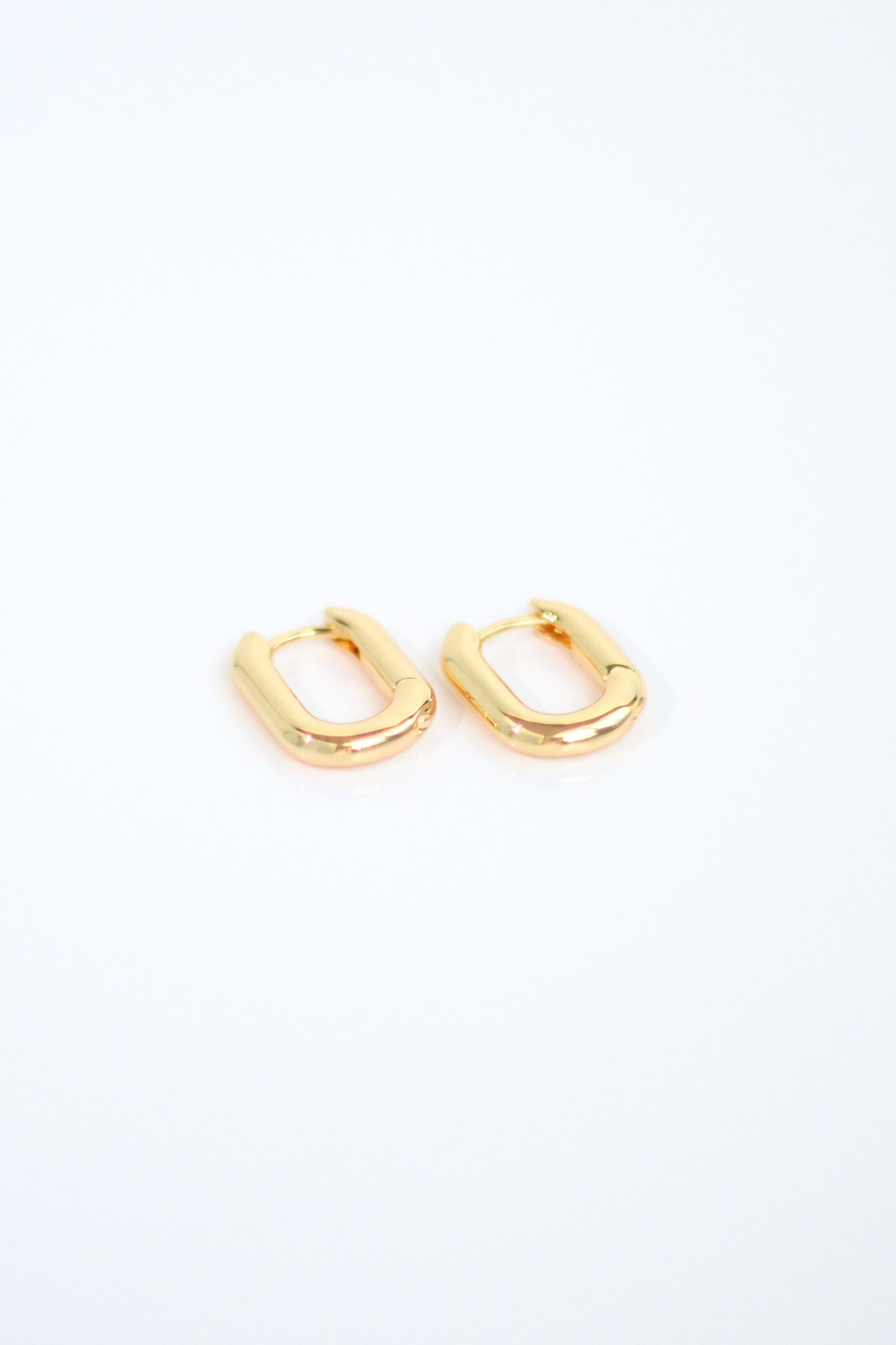 Small U Hoop Huggie Earrings. 18K Gold plated. From KADOU Boutique.