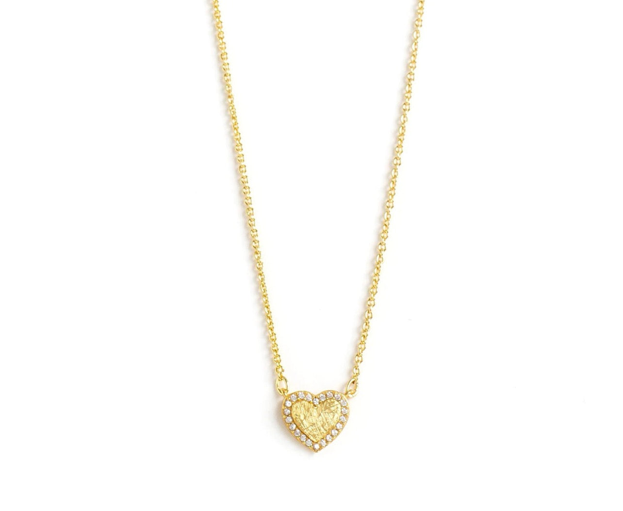 The gold heart necklace features, an embossed distressed style within the gold heart garnished by a border of shimmery cubic zirconia stones.The heart charm is hanging from  a yellow-gold toned adjustable 18" chain. 