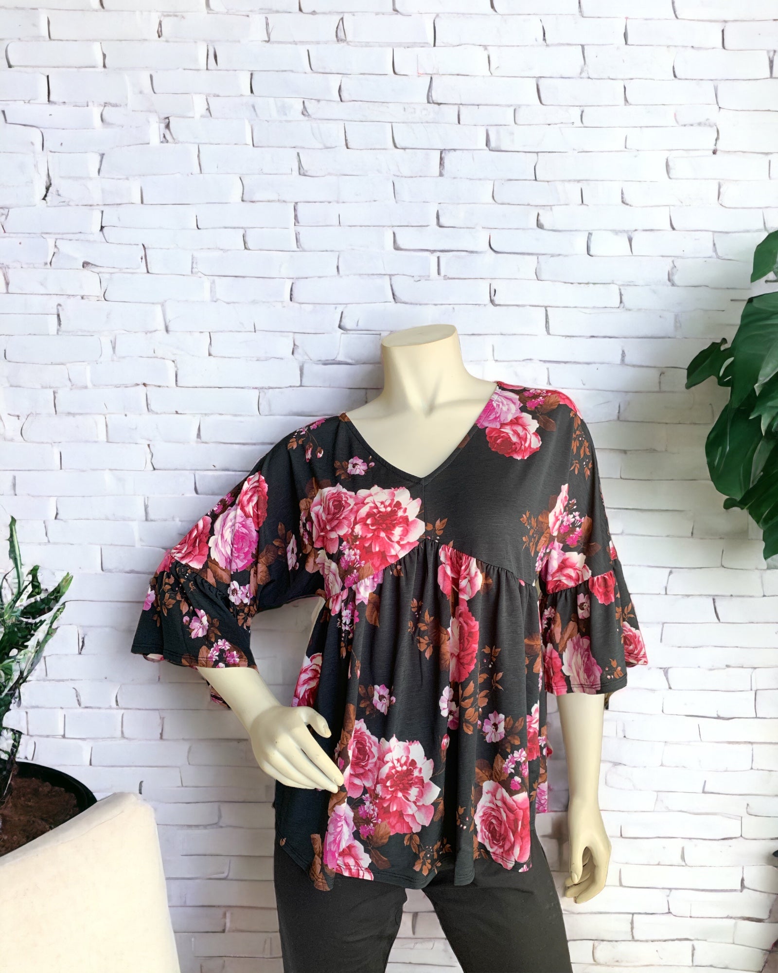 Dozen Roses Empire-Waist Top worn with black leggings.